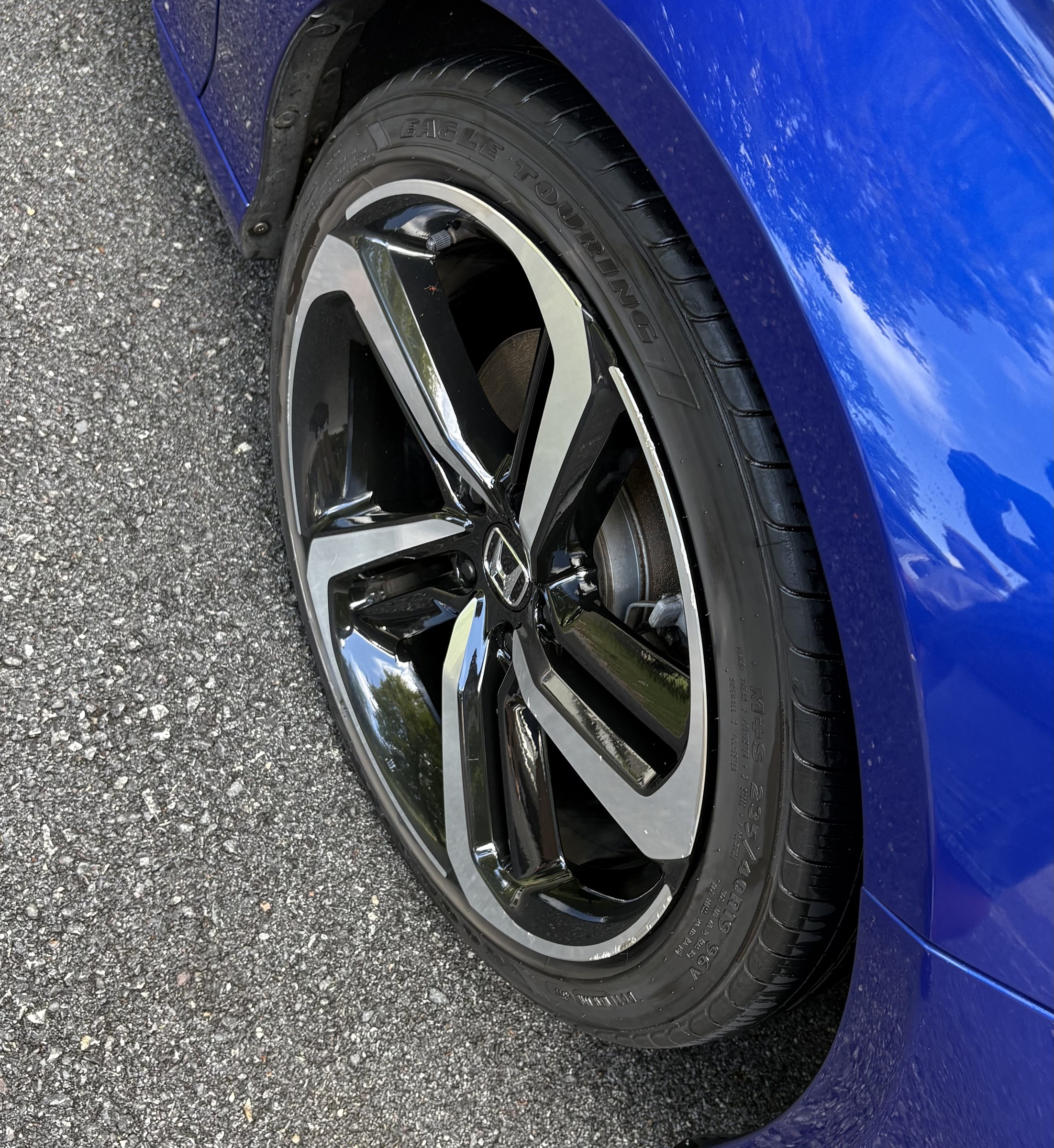 Gloss-black Honda Accord Sport wheel and dressed tire after wheel and tire detailing in Pocopson, PA &mdash; brake dust removed from the barrel and faces cleaned by hand by Precision Details