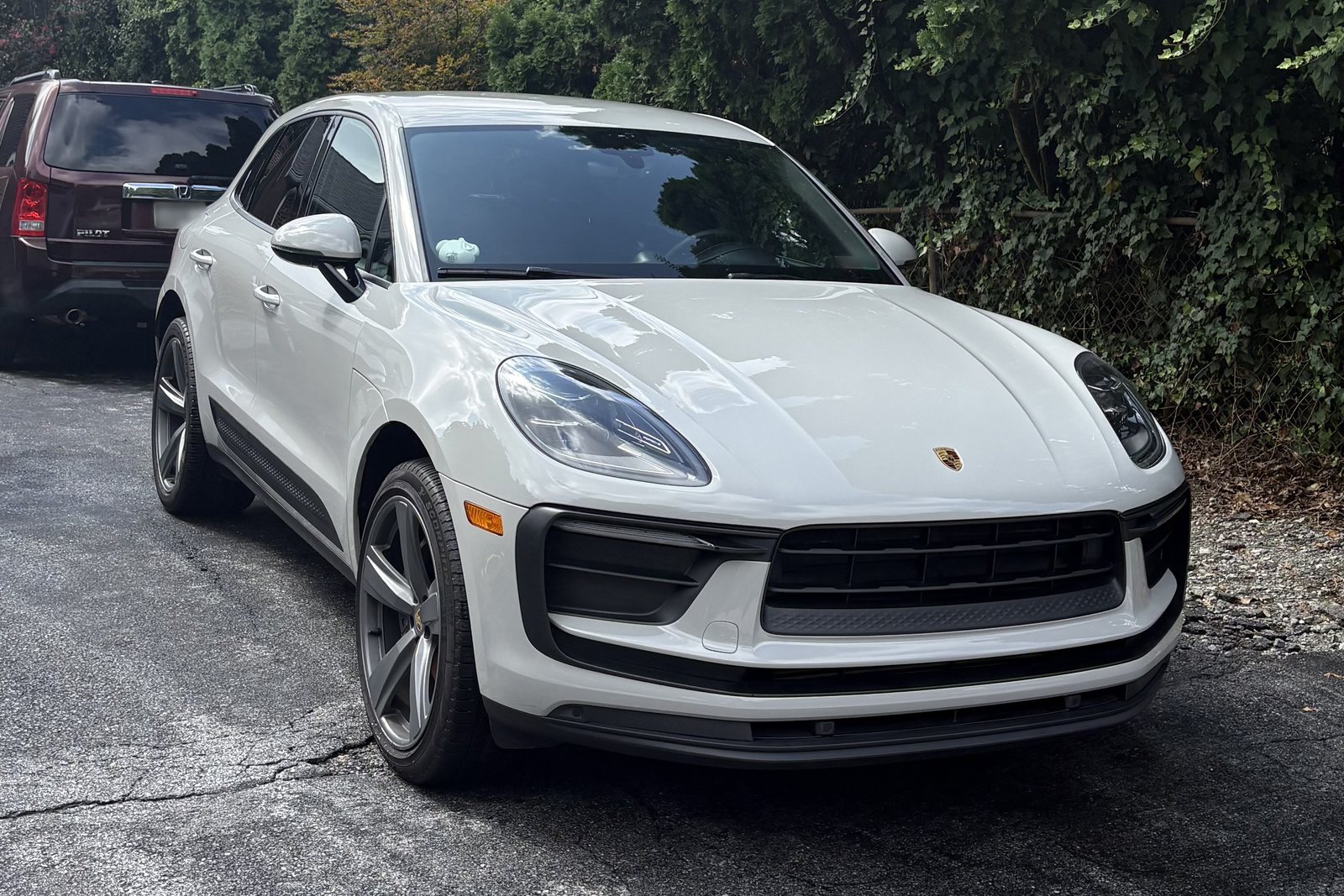 White Porsche Macan after a mobile exterior detail by Precision Details in West Chester, PA — two-bucket hand wash, clay bar decontamination and hand-dried paint