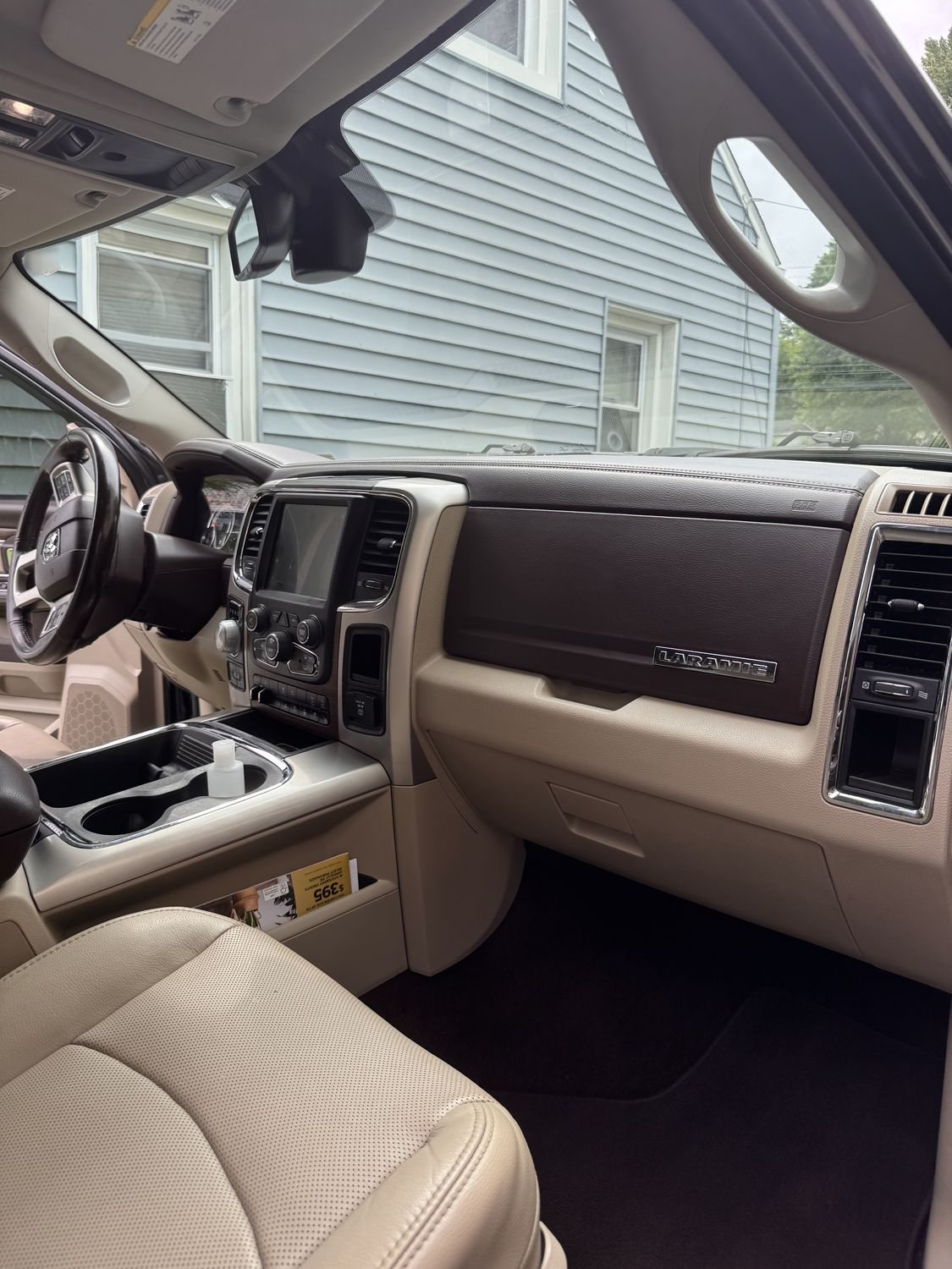 Ram 1500 Laramie cabin with light leather after a mobile interior detail by Precision Details in Downingtown, PA — leather cleaned and conditioned, carpets extracted