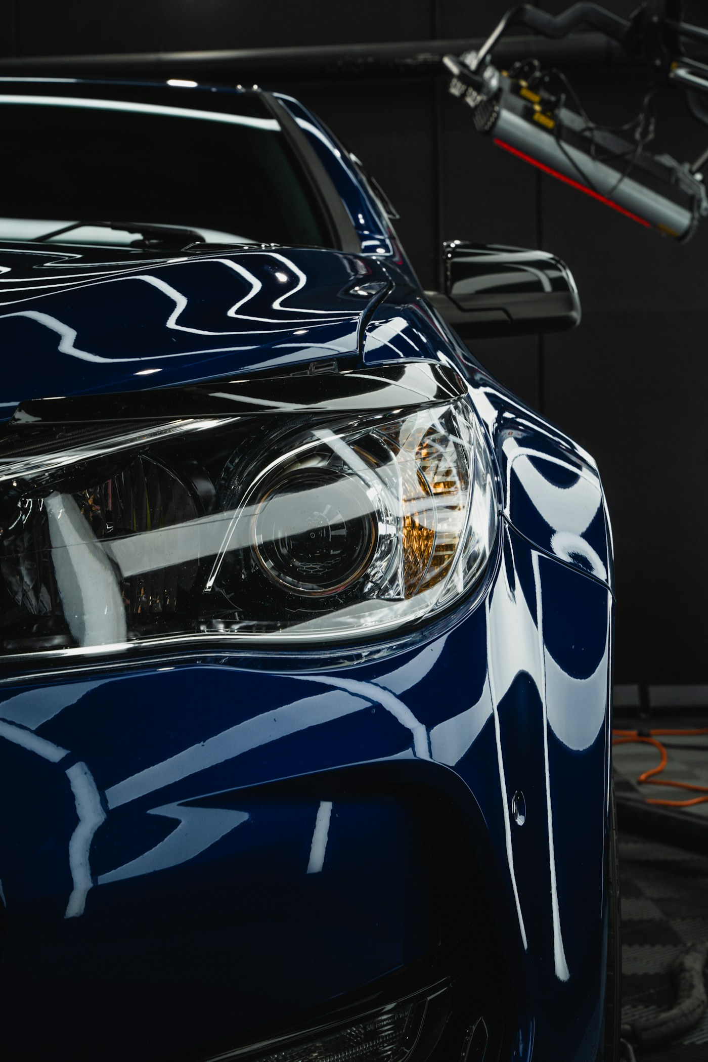 Deep blue sedan with a mirror finish after detail