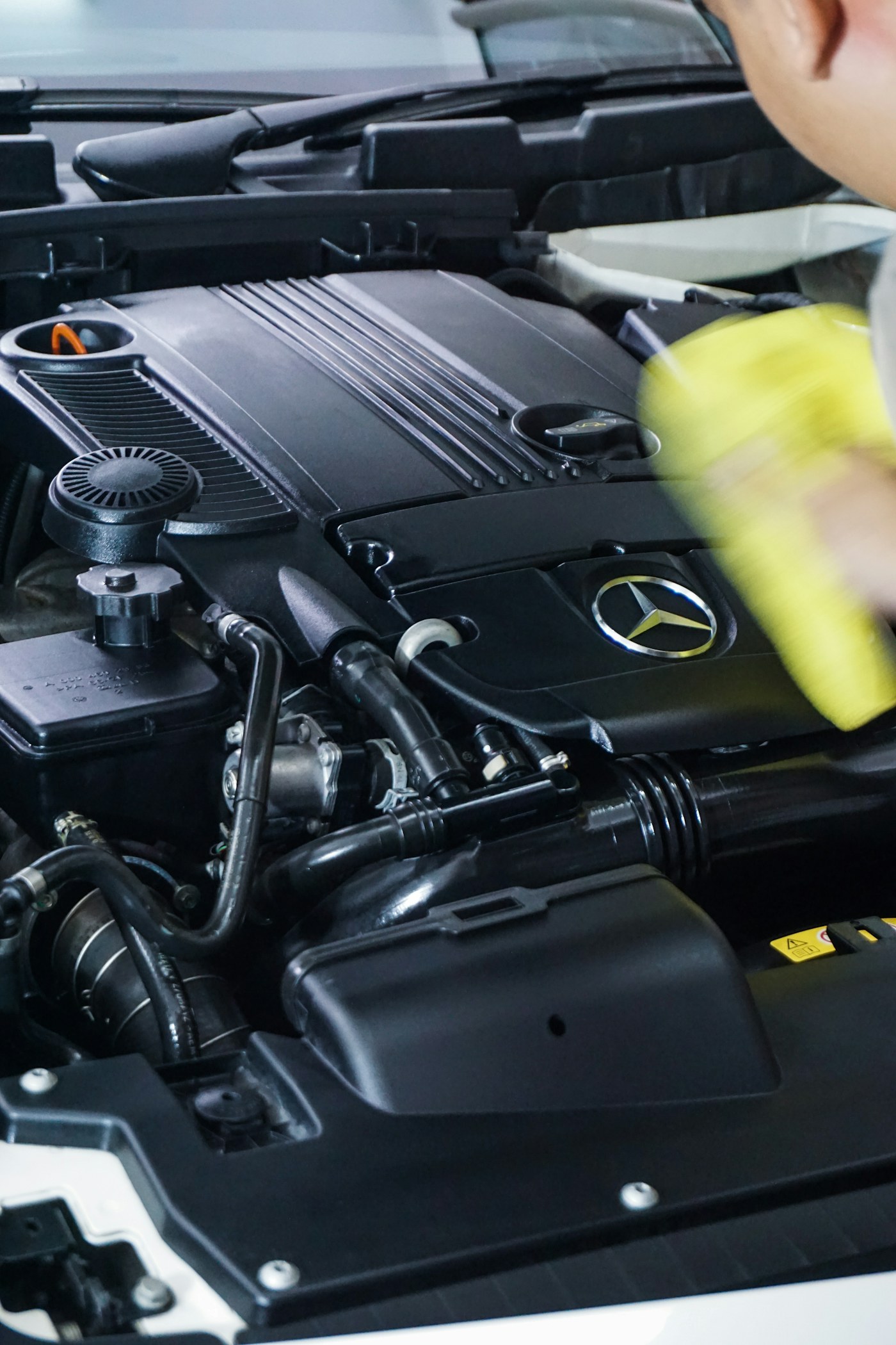 Engine bay being cleaned and dressed