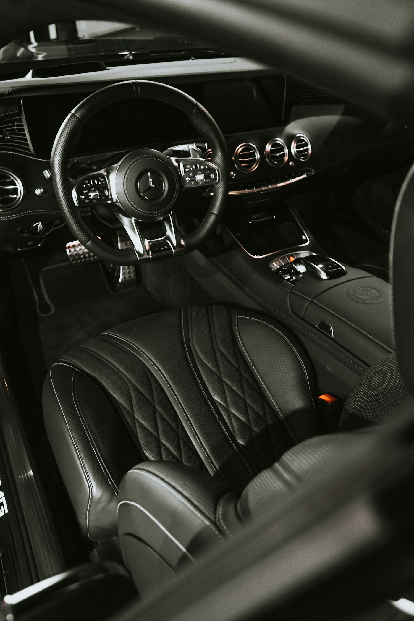 Black quilted leather interior, detailed
